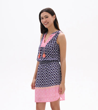 Sleeveless navy and pink patterned dress with tassel ties, shown on model front view
