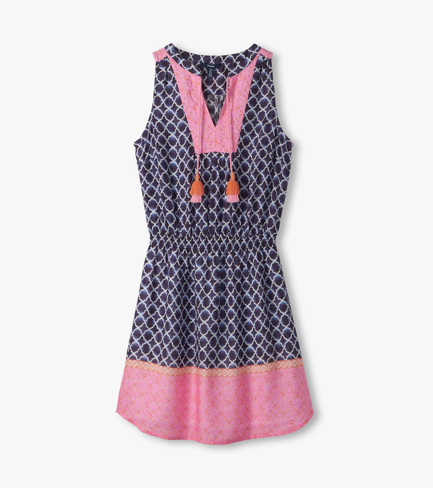 Sleeveless navy and pink patterned dress with V-neck, tassel ties, and flared hem, front view