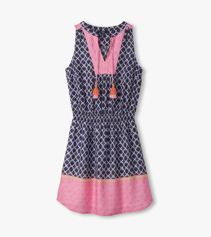 Sleeveless navy and pink patterned dress with V-neck, tassel ties, and flared hem, front view
