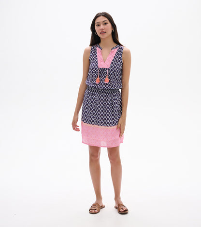Sleeveless navy and pink patterned knee-length dress with tassel ties, front view