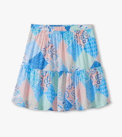 Patchwork flounce skirt with blue, pink, and mint geometric and floral prints, front view