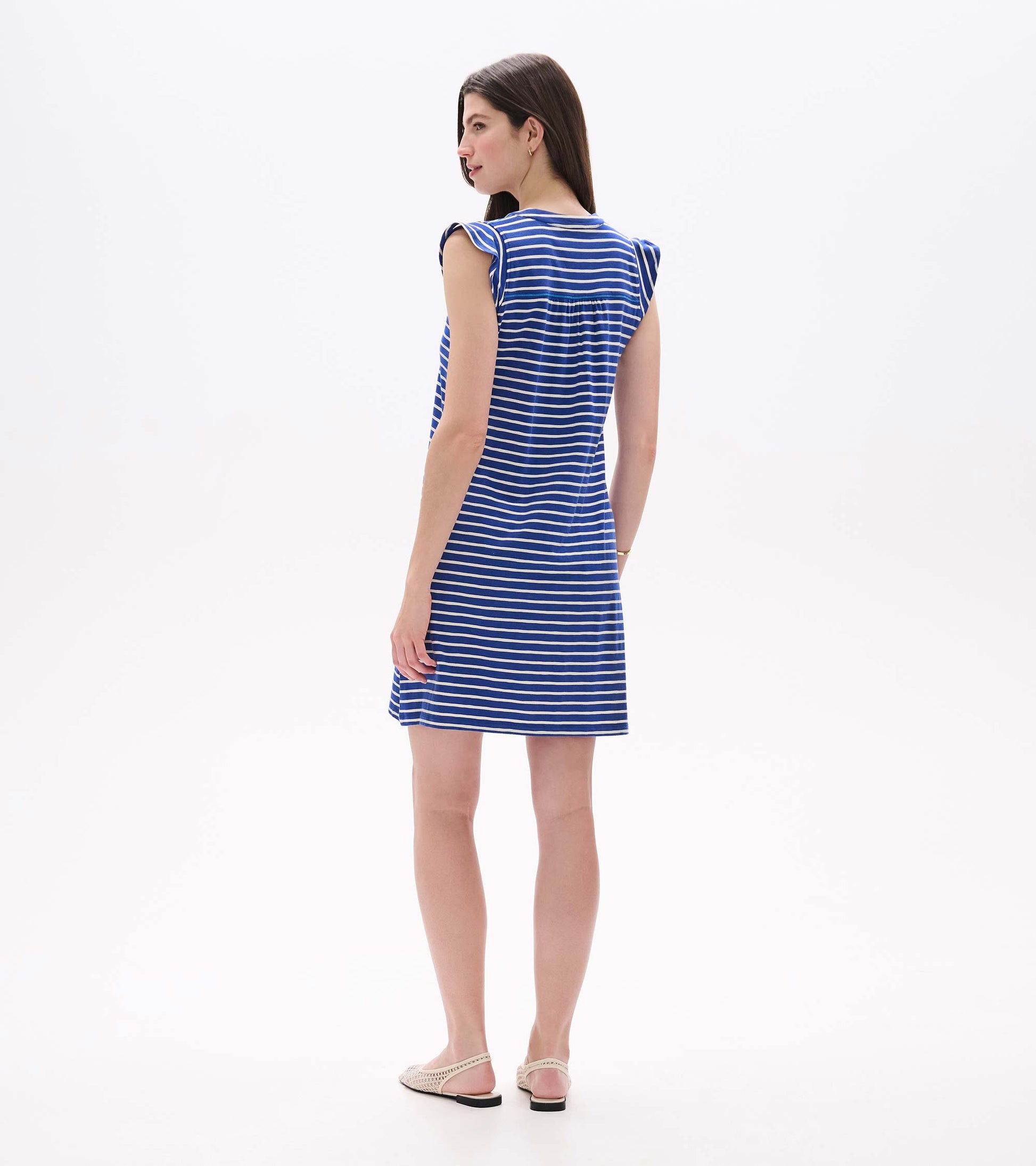 Back view of navy striped tank dress with gathered yoke and cap sleeves