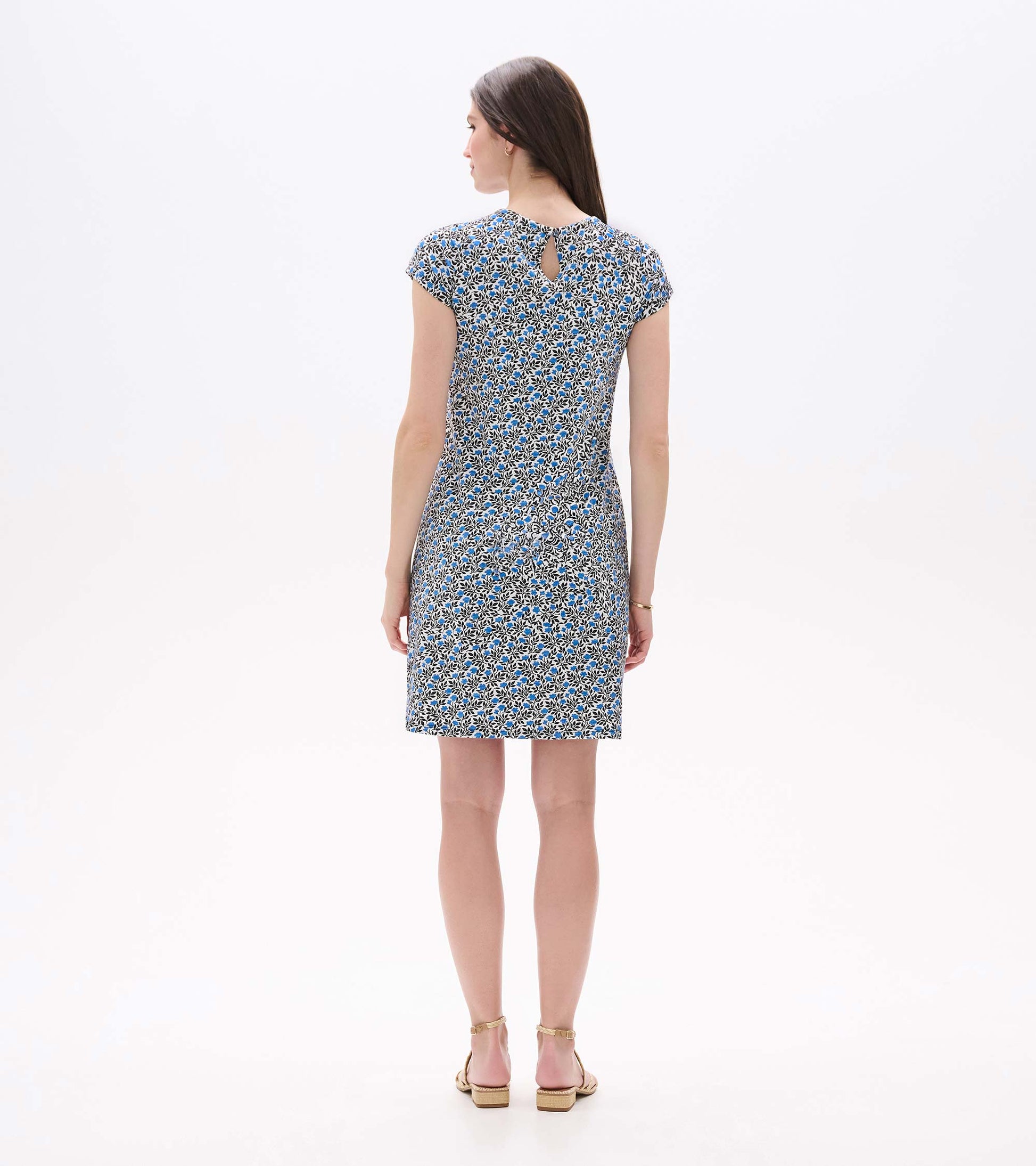 Back view of Cici A-line dress with short sleeves, back keyhole, and blue floral vine print