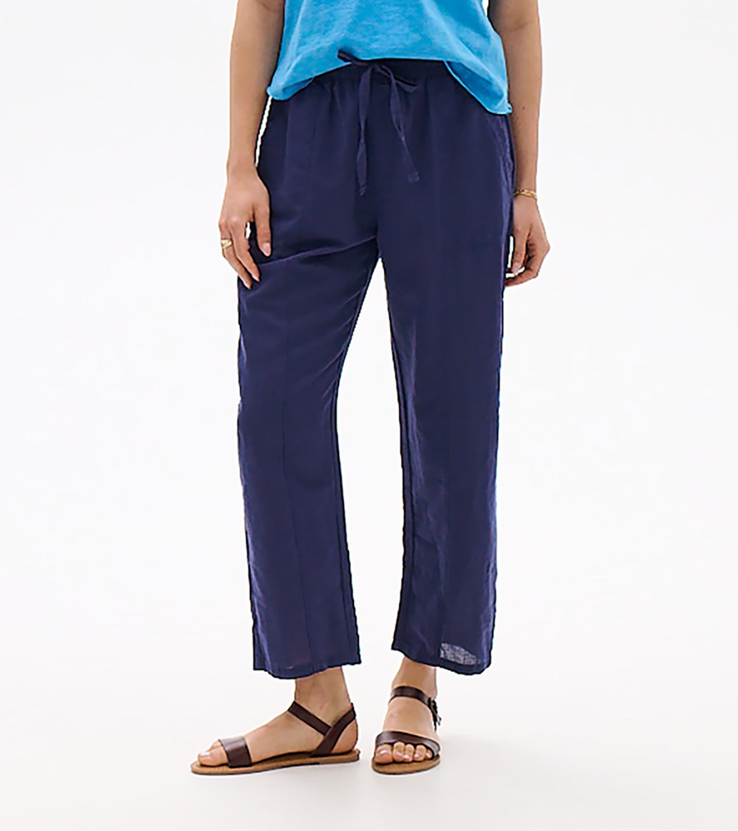 Women’s navy straight-leg pants with elastic waist and drawstring, shown on model with sandals