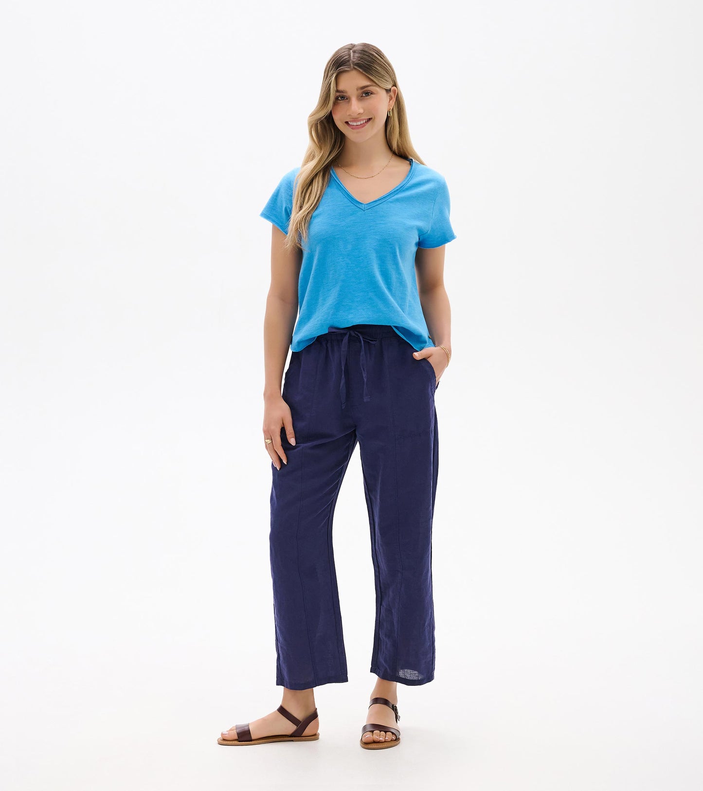 Front view of navy straight-leg pants with elastic waist and drawstring, worn with a blue T-shirt.