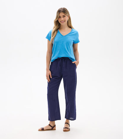 Front view of navy straight-leg pants with elastic waist and drawstring, worn with a blue T-shirt.