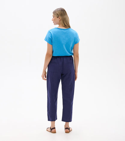 Back view of navy straight-leg pants with cropped ankle length and elastic waistband