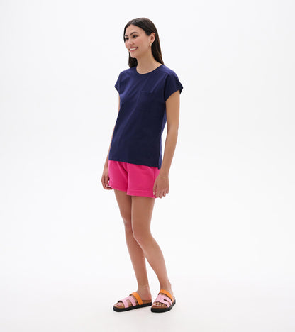 Woman wearing a navy relaxed-fit short-sleeve tee with chest pocket, front view