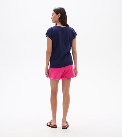 Back view of a relaxed navy short-sleeve tee with a loose fit and curved hem