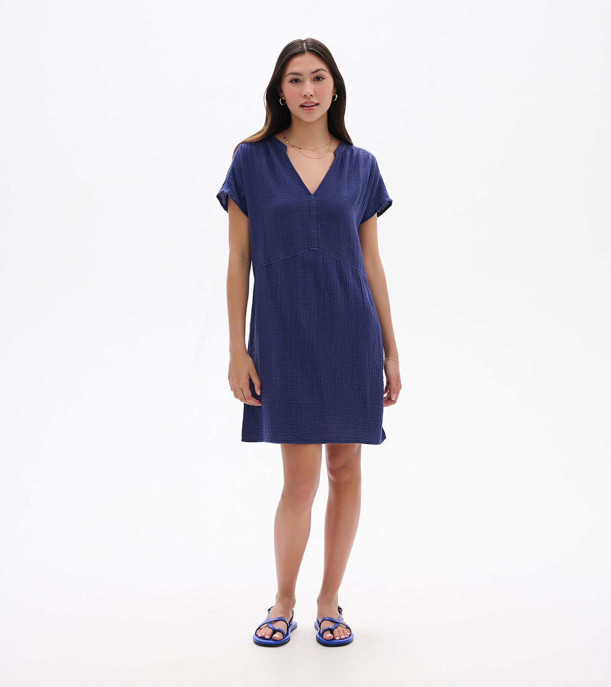 Front view of a navy blue short-sleeve V-neck knee-length dress with a relaxed fit and textured fabric