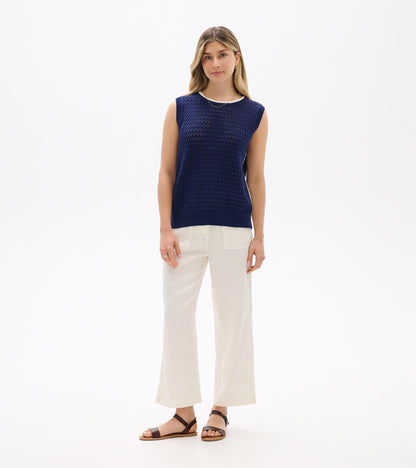 Navy blue sleeveless knit tank top with textured open weave and ribbed trim, front view.
