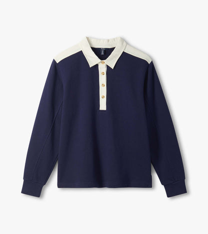 Navy long-sleeve polo top with cream collar, placket, and shoulder accents, front view