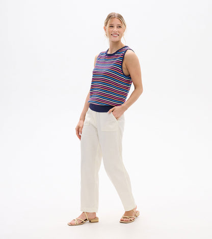Sleeveless knit tank with multicolor horizontal stripes and navy trim, front view on model.