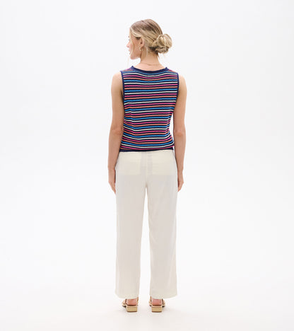 Back view of sleeveless knit tank with multicolor horizontal stripes and navy trim, worn with light pants.