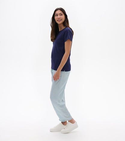 Navy blue short-sleeve crew neck tee with a relaxed fit, shown on a model in side view.