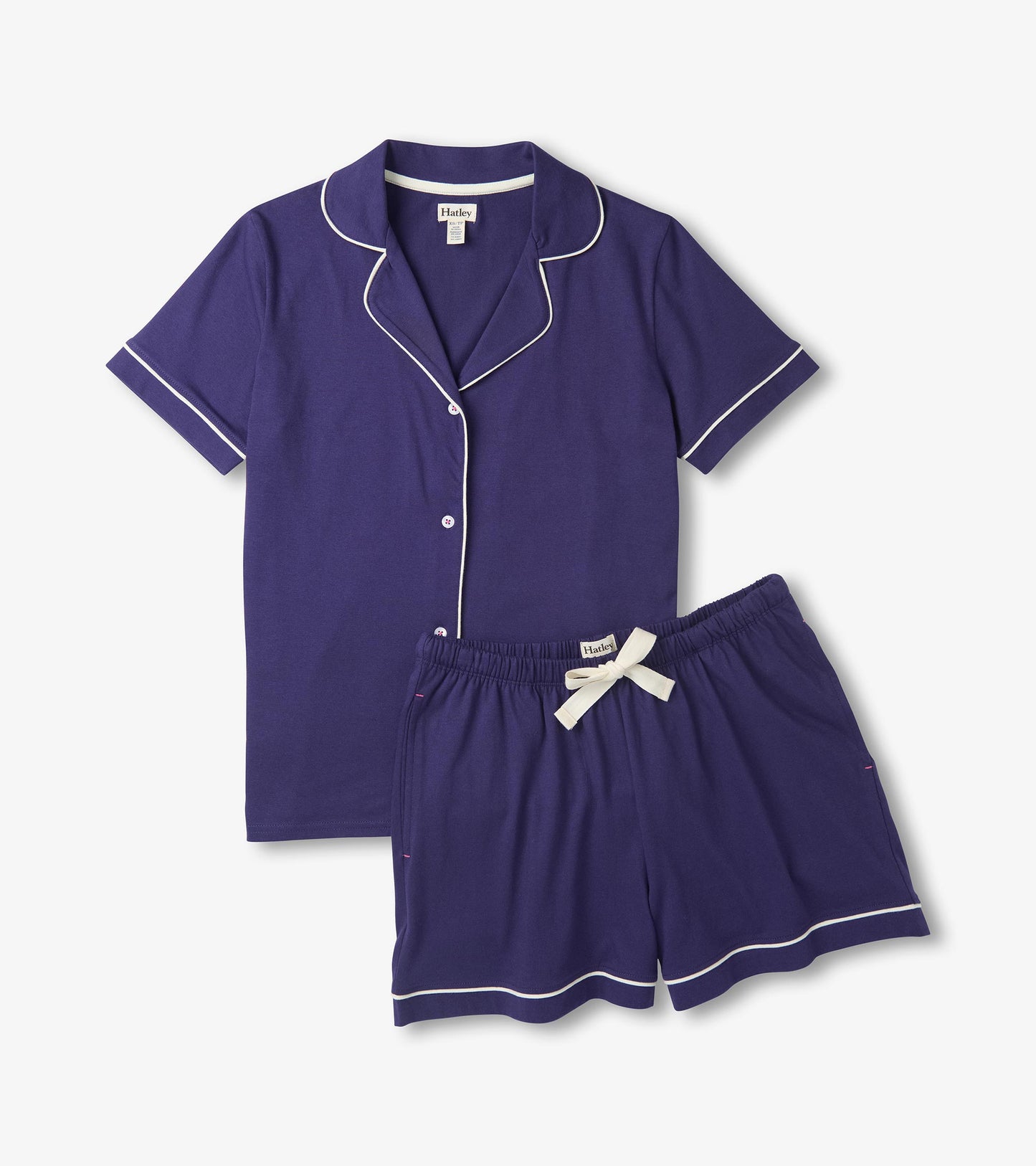 Navy short pajama set with white piping, button-front top, and drawstring shorts
