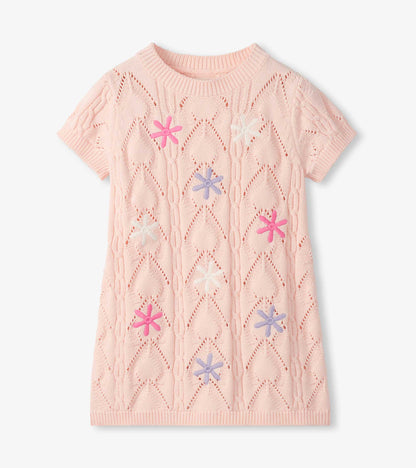 Light pink crochet short-sleeve dress with openwork pattern and colorful flower appliqués, front view