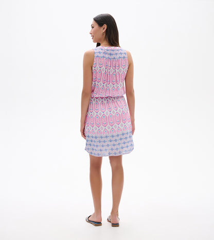 Back view of Chloe Dress in pink and blue print with sleeveless silhouette and floral border hem