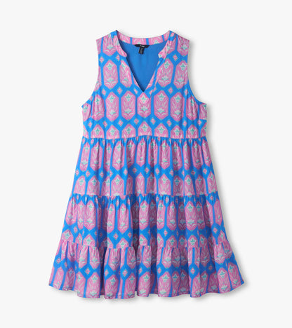 Blue and pink sleeveless dress laid flat, showing V-neckline, empire seam and tiered skirt