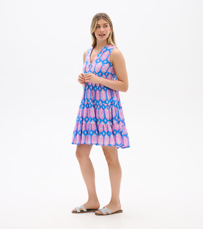 Sleeveless blue dress with pink floral print, shown from the side with V-neck and tiered skirt