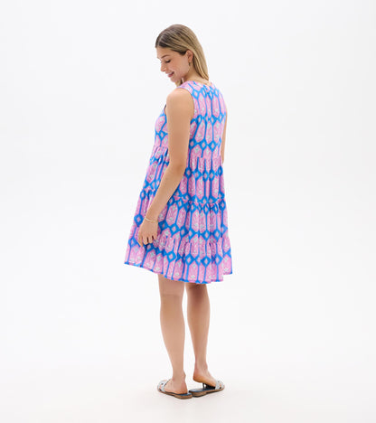 Sleeveless blue dress with pink floral print, shown from the back with tiered skirt