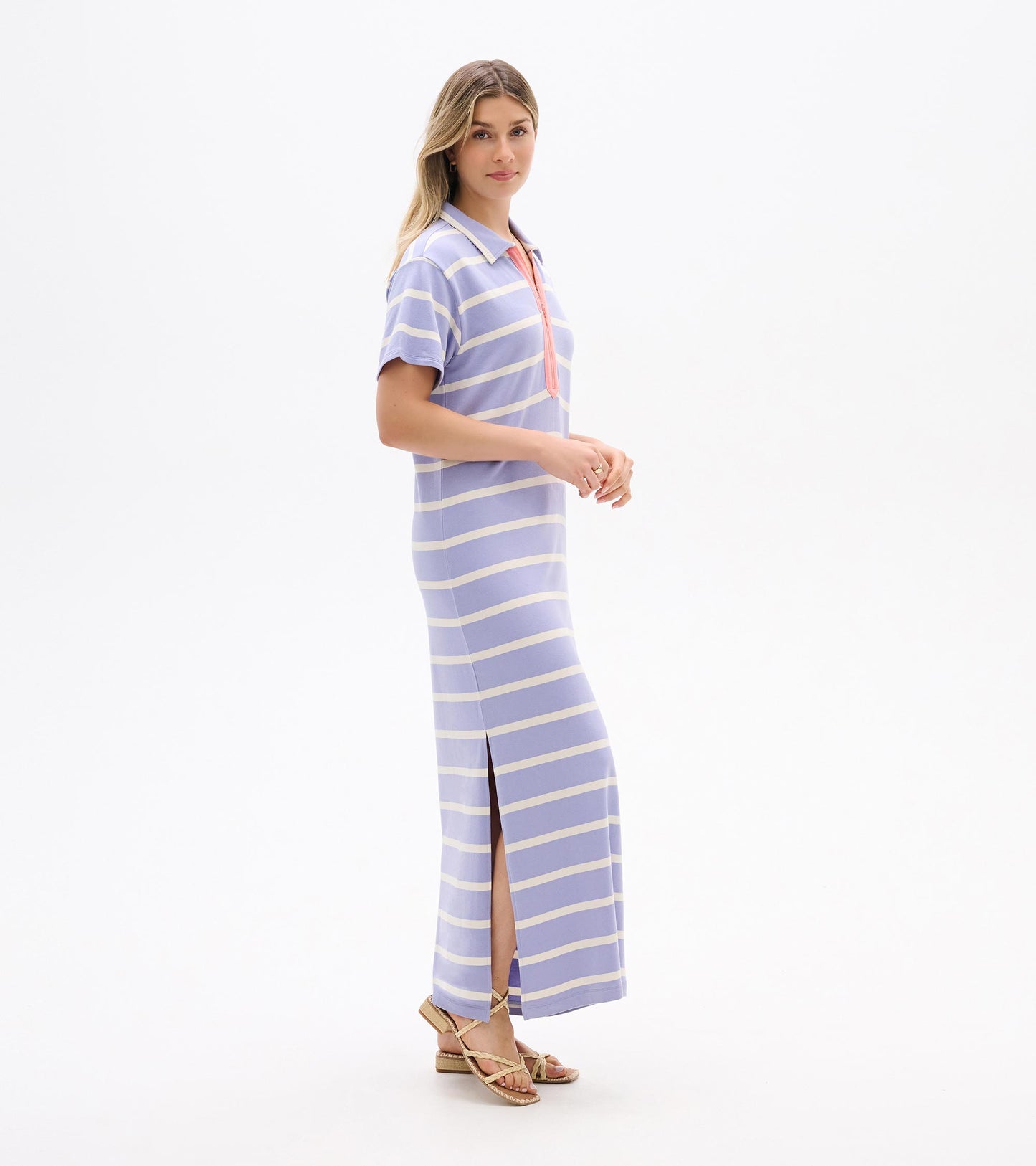 Pale lavender striped maxi dress with short sleeves, collar, zip neckline, and side slit, worn by model