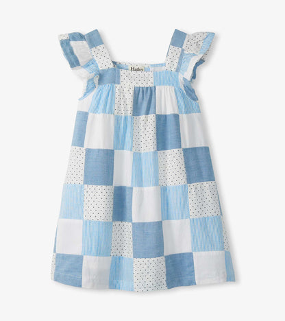 Blue and white patchwork girls dress with flutter sleeves, square neckline, and straight silhouette