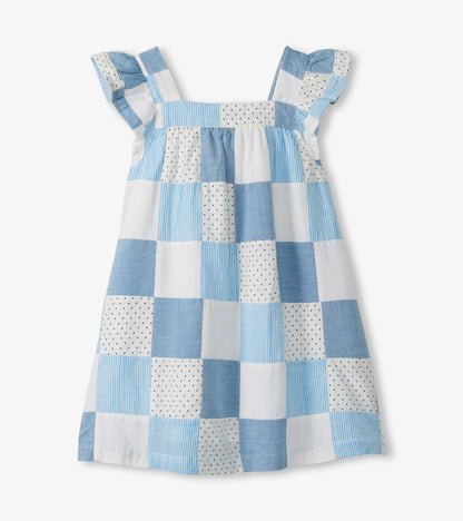 Back view of girls patchwork dress in blue and white with flutter sleeves and square neckline