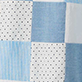 View Girls Chambray Patches Flutter Puff Dress - Patchwork fabric pattern with blue, white, and gray squares and dotted sections