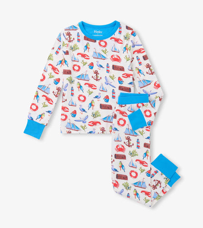 White boys' bamboo pajama set with colorful seascape print and bright blue trim, long sleeves and pants