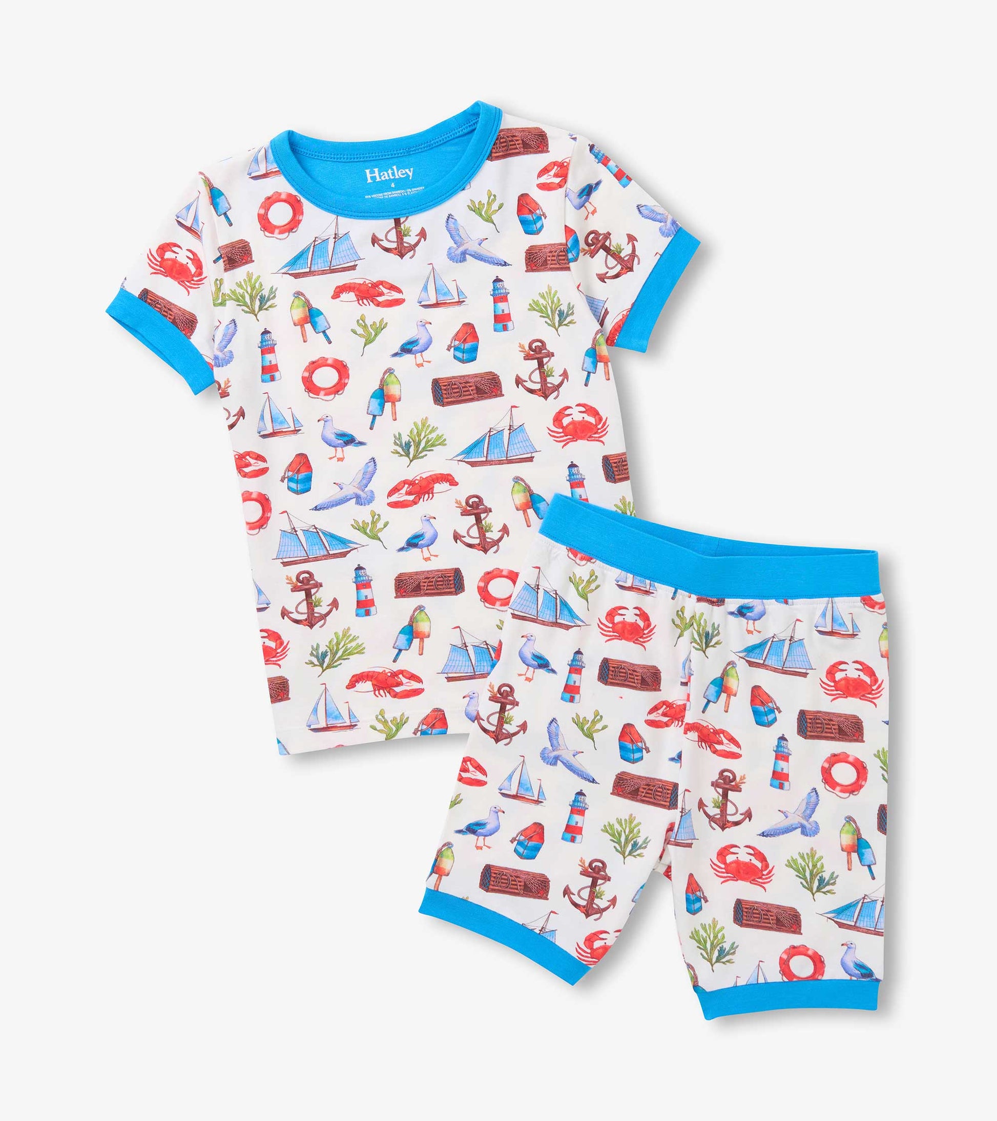 White short pajama set with blue trim and colorful seascape print, shown folded front view