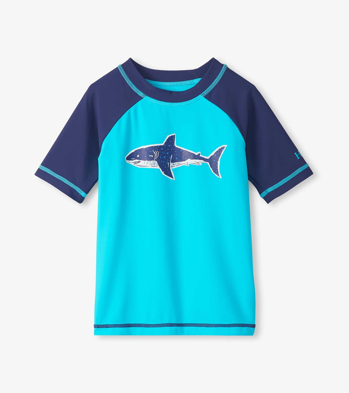 Blue and navy short sleeve boys rashguard with shark graphic, front view