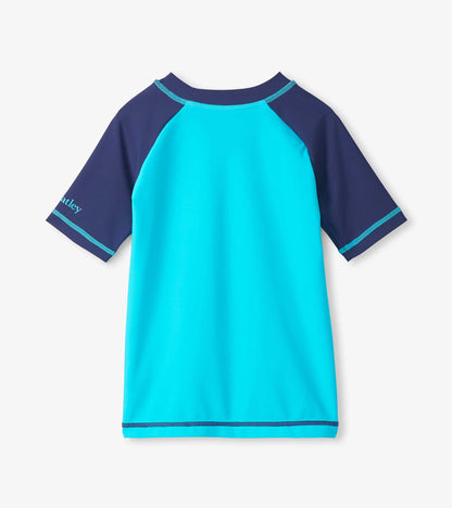 Blue and turquoise boys short sleeve rashguard, front view, with navy sleeves and trim
