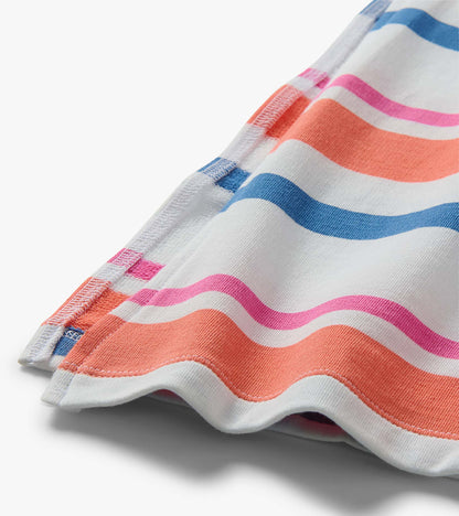Close-up of white midi dress fabric with colorful horizontal stripes and pleated sleeve detail