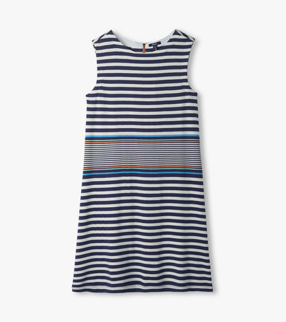 Flat lay of sleeveless striped dress with navy and white stripes and blue and coral accent bands