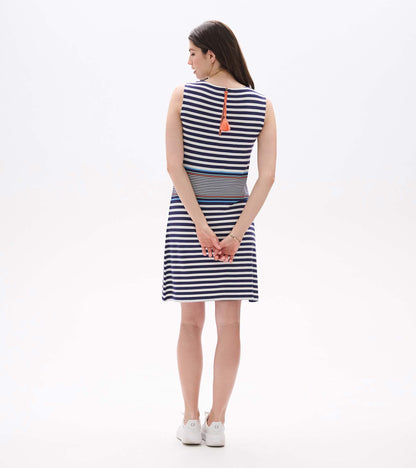 Back view of sleeveless striped dress with exposed back zipper and coral tassel pull