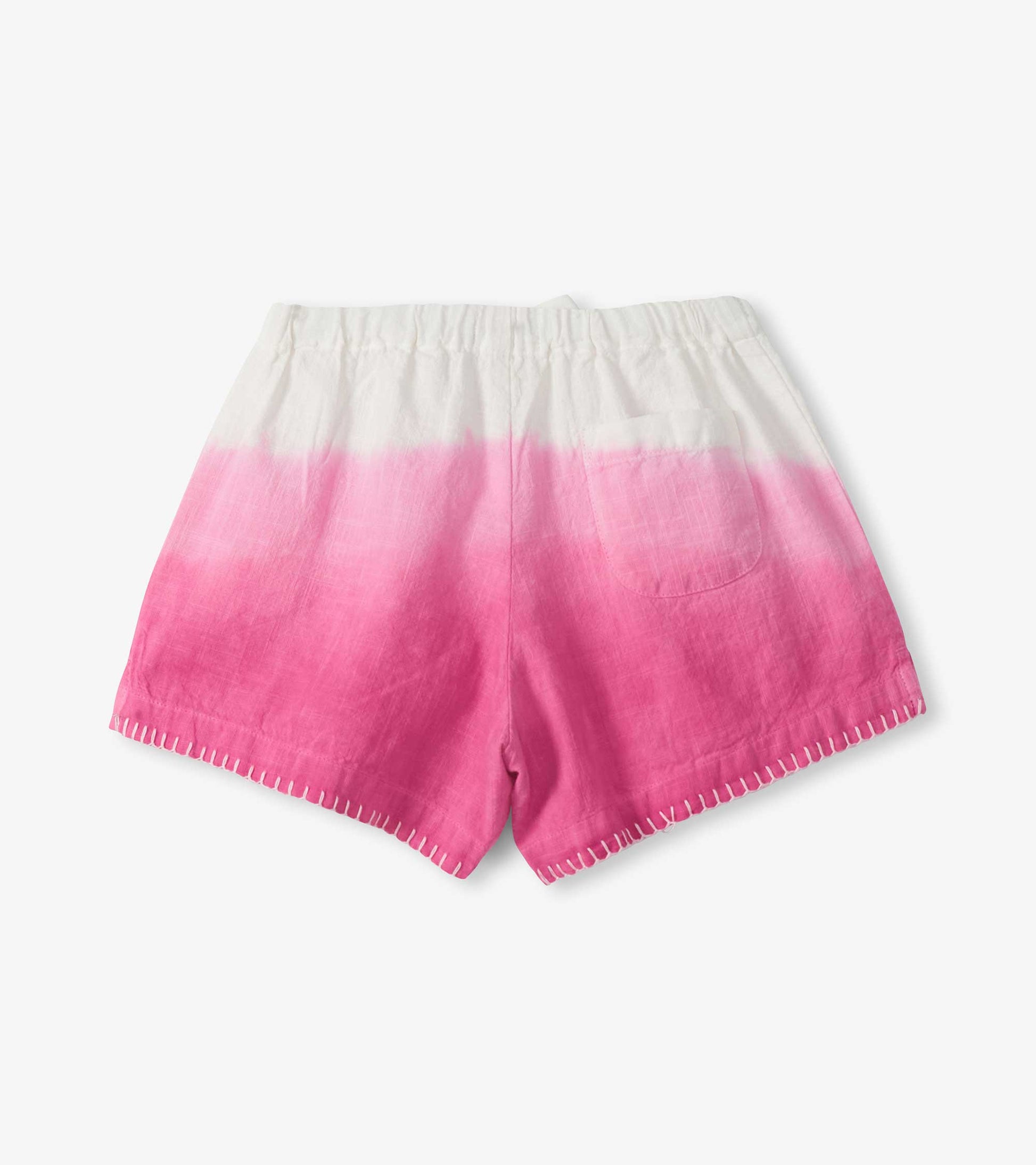 Girls woven shorts with white-to-pink dip dye, elastic waist, and stitched hem, front view