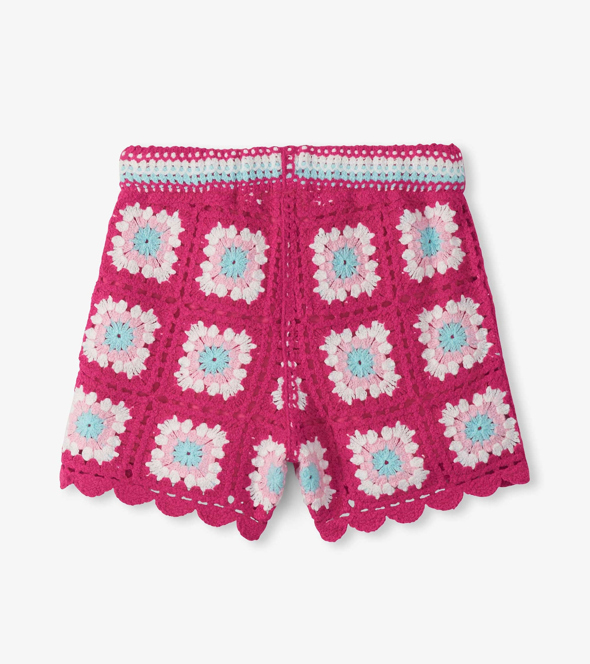 Pink crochet girls shorts with scalloped hem and pastel floral pattern, front view