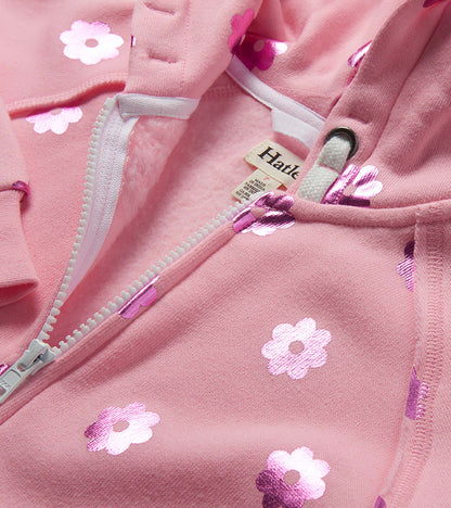 Pink girls zip-up hoodie with white flower print and drawstring hood, close-up front view