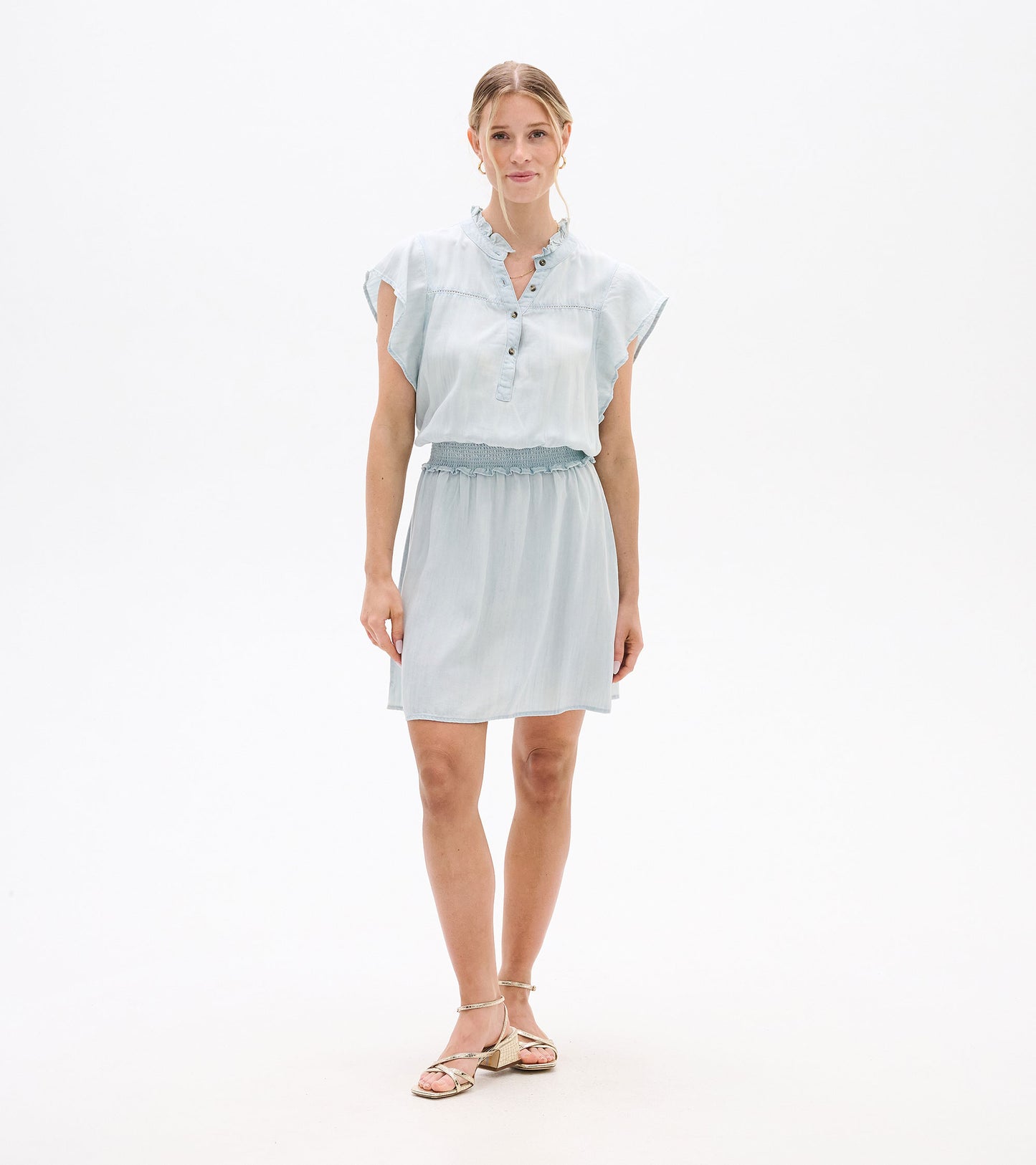 Light blue short-sleeve dress with ruffled collar, button placket, and smocked waist, front view