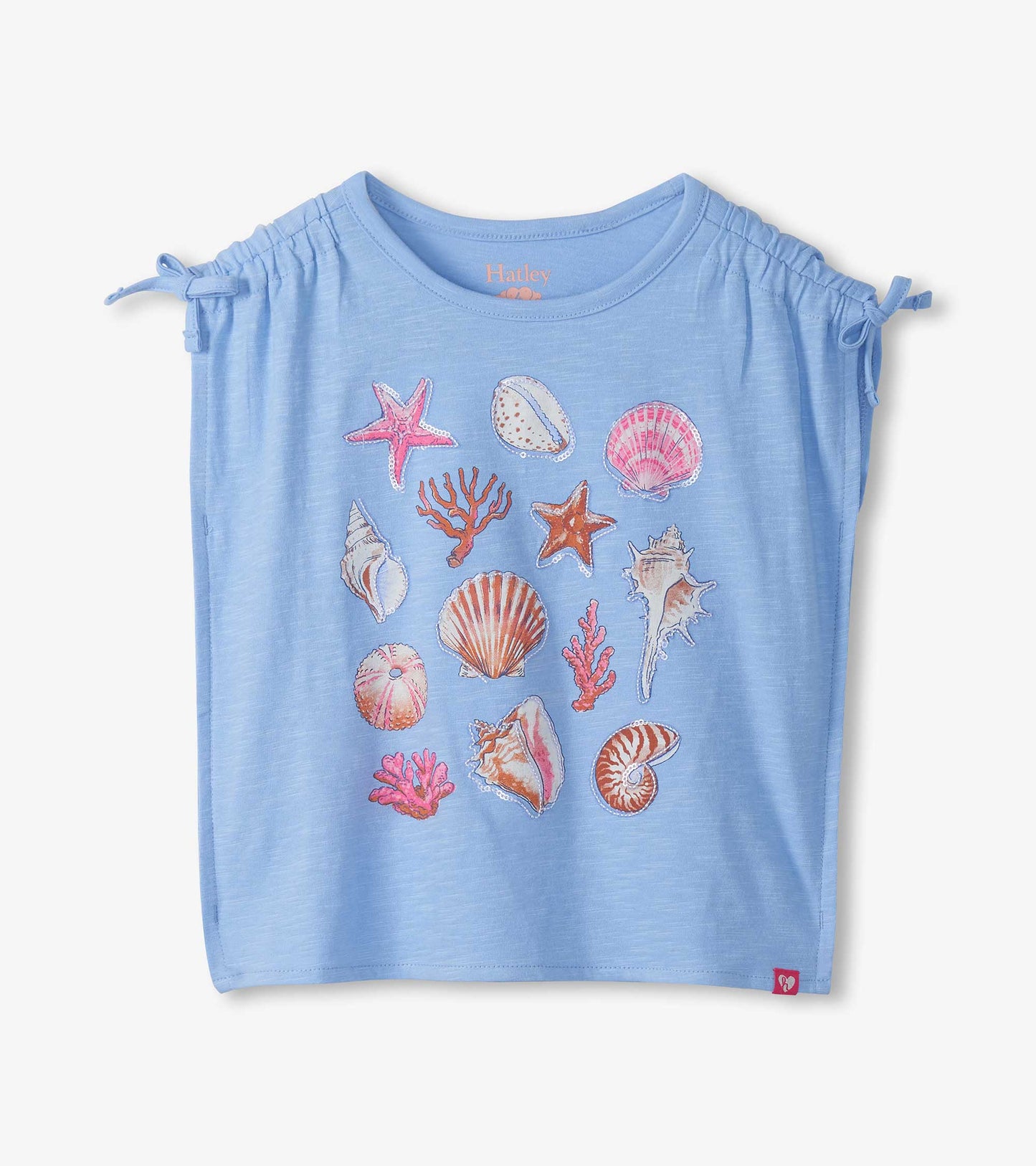 Light blue girls top with cinched shoulders and colorful sea shell and coral print, front view