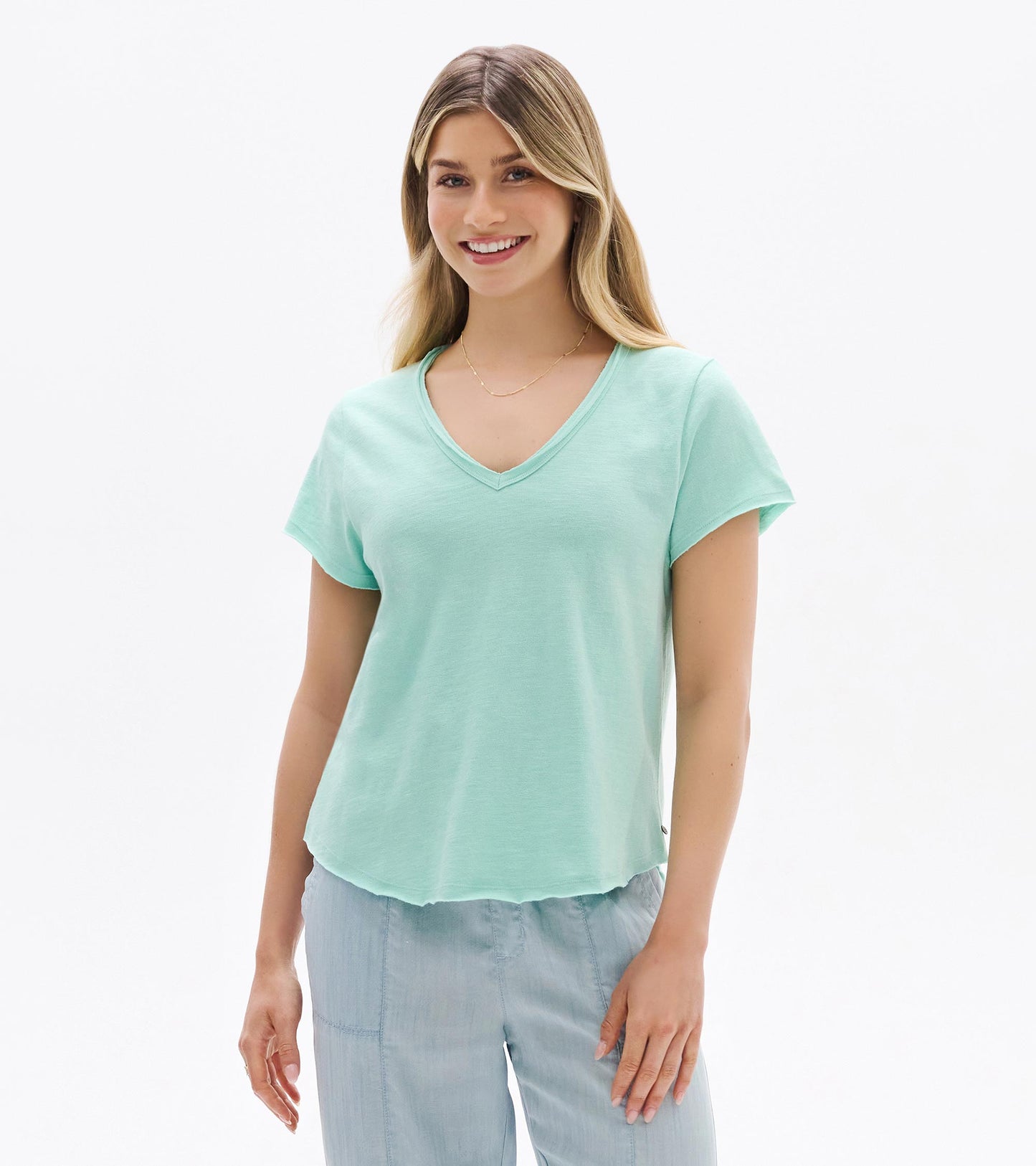 Light sea glass V-neck short-sleeve tee on a model, front view, with a relaxed fit.