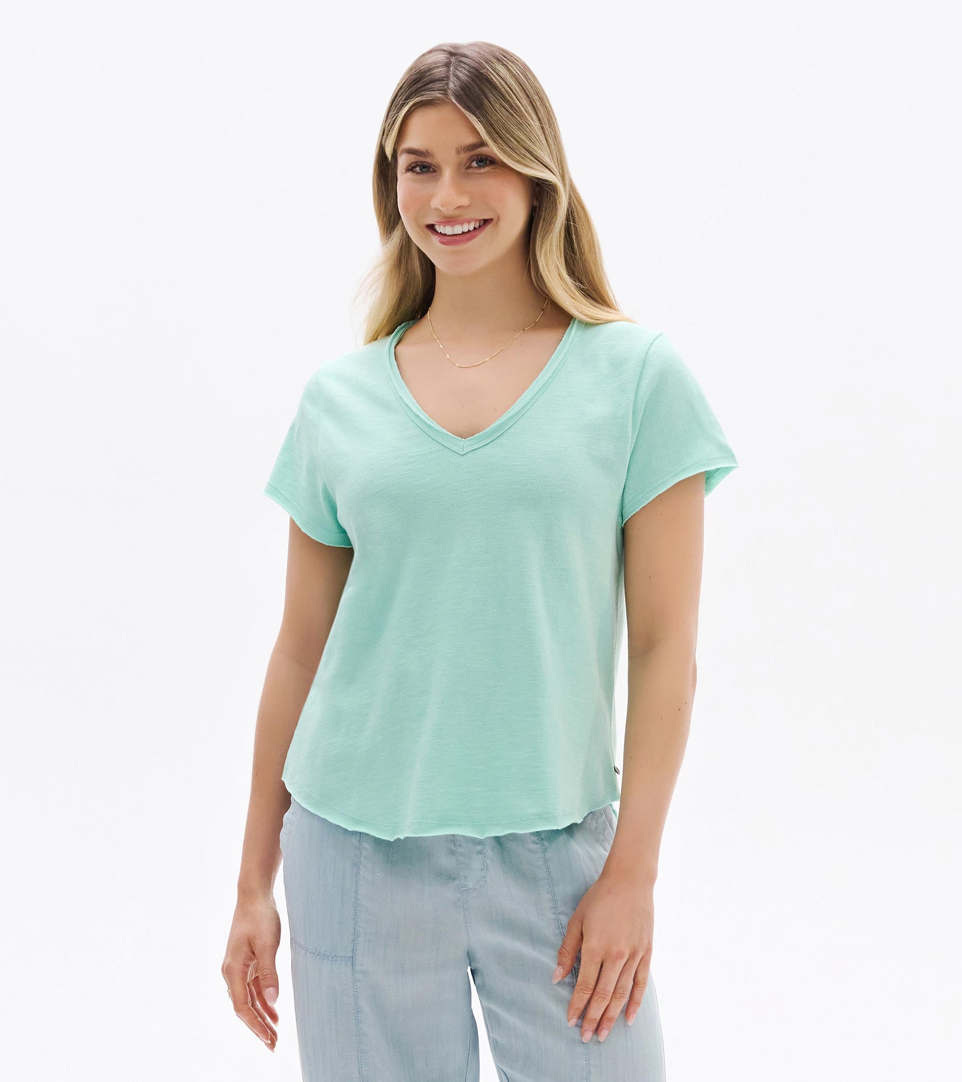 Light sea glass V-neck short-sleeve tee on a model, front view, with a relaxed fit.