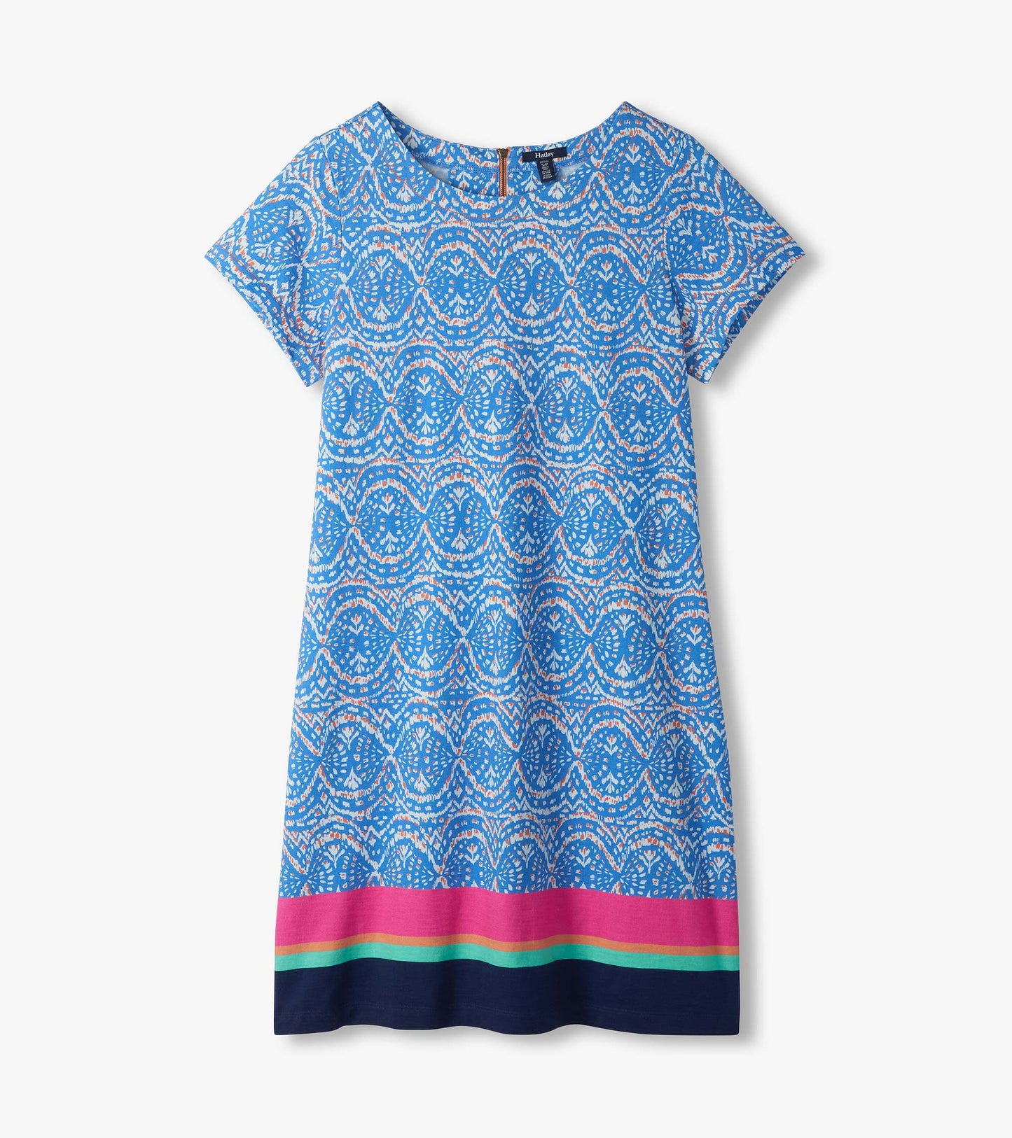 Flat lay of blue and white ikat tee dress with short sleeves and pink, aqua, and navy striped hem