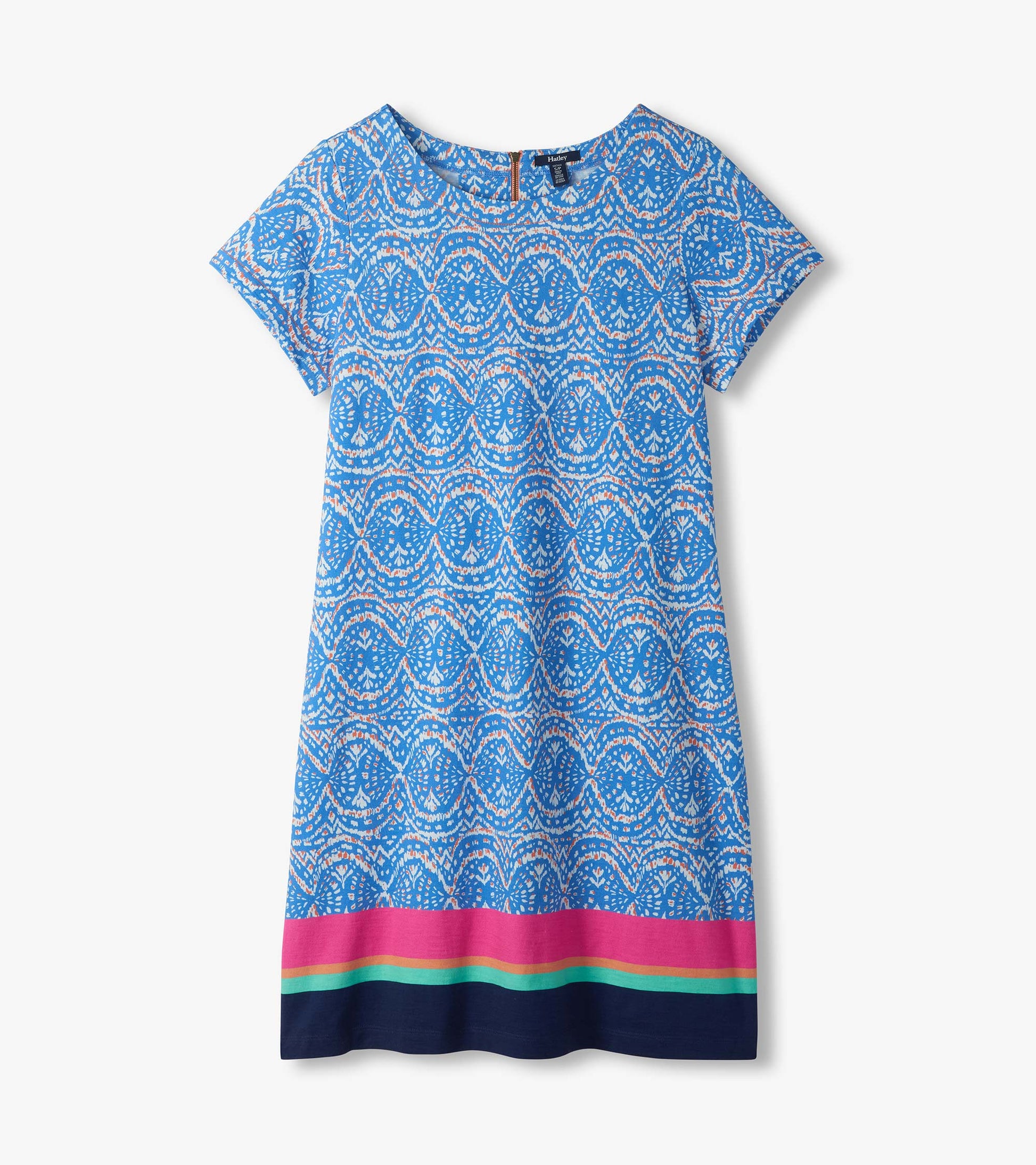 Flat lay of blue and white ikat tee dress with short sleeves and pink, aqua, and navy striped hem