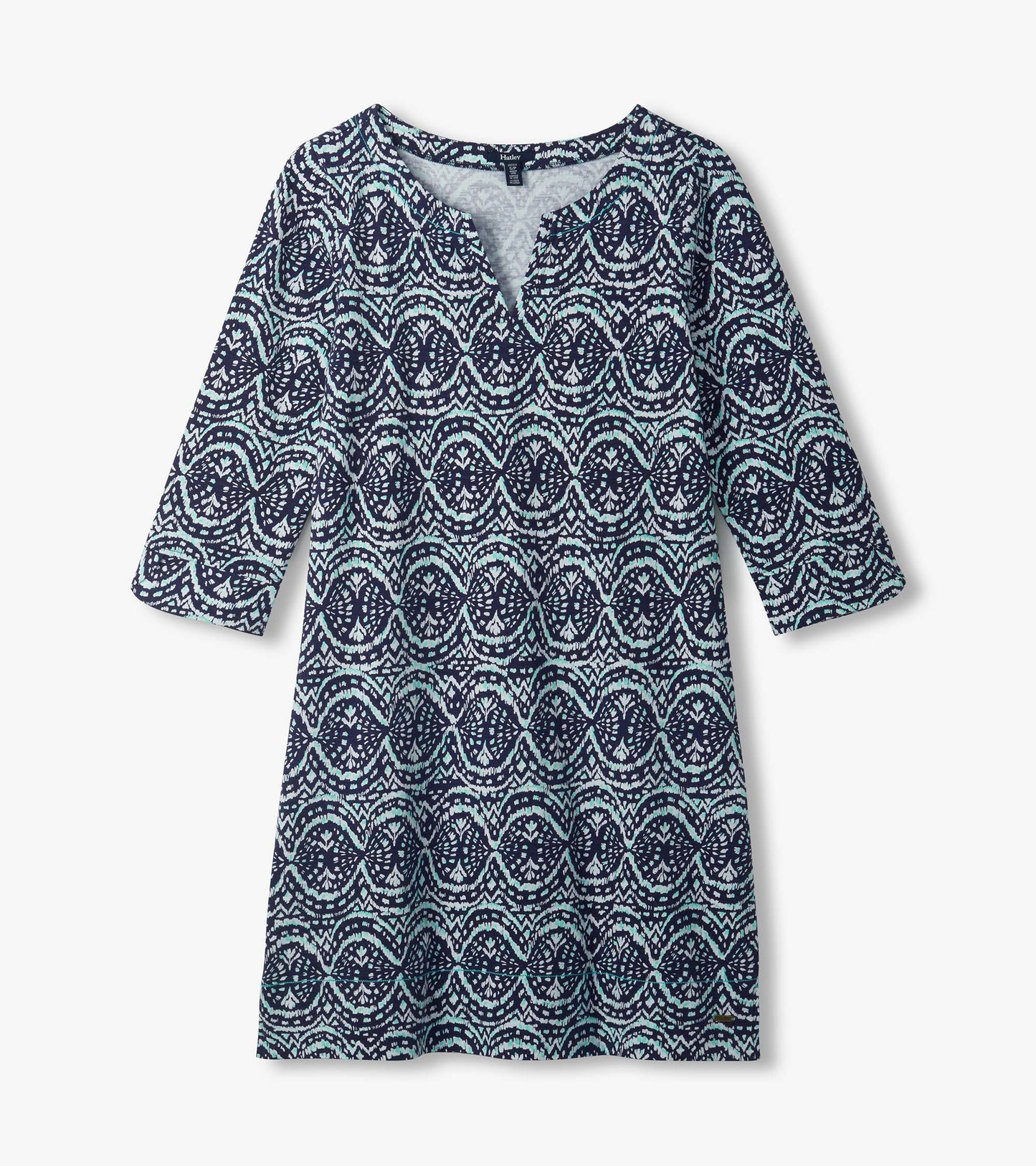 Flat lay of navy Lily notch neck dress with aqua and white ikat print and three-quarter sleeves