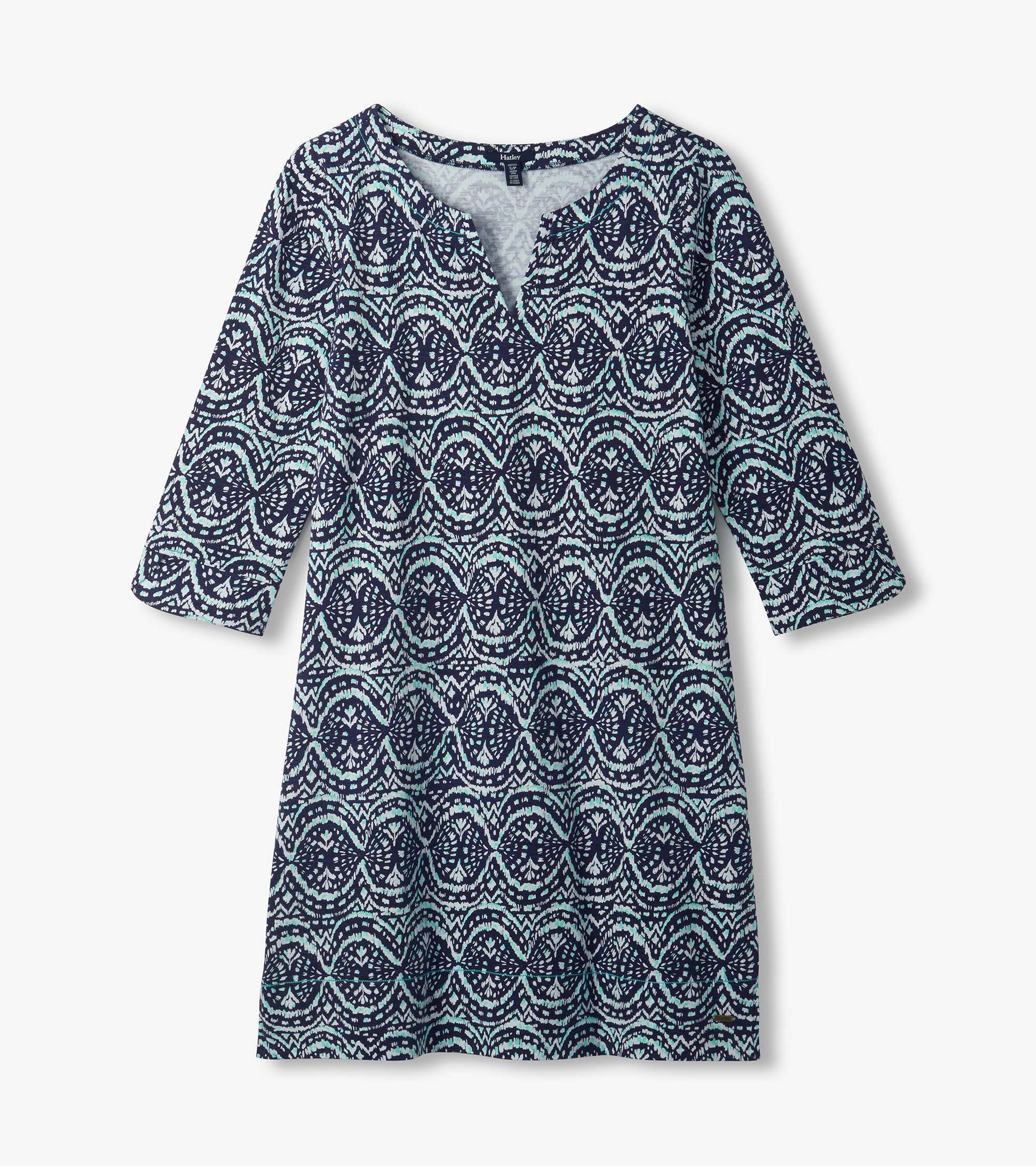 Flat lay of navy Lily notch neck dress with aqua and white ikat print and three-quarter sleeves