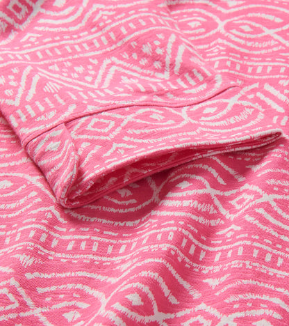Close-up of pink and white sketched line pattern fabric with folded hem detail