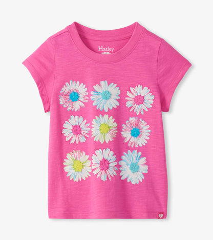Bright pink short sleeve tee with nine white daisy graphics and colorful raised flower centers