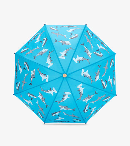 Blue kids umbrella with shark pattern, shown open from above